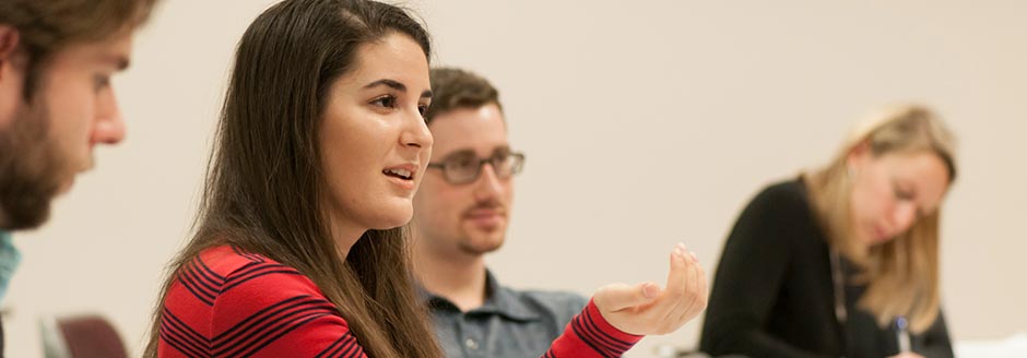 Woman gestures in class