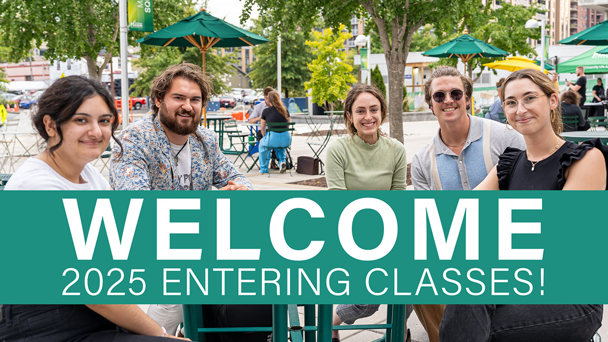 five people sitting at table outside with words "Welcome 2025 Entering Classes!"