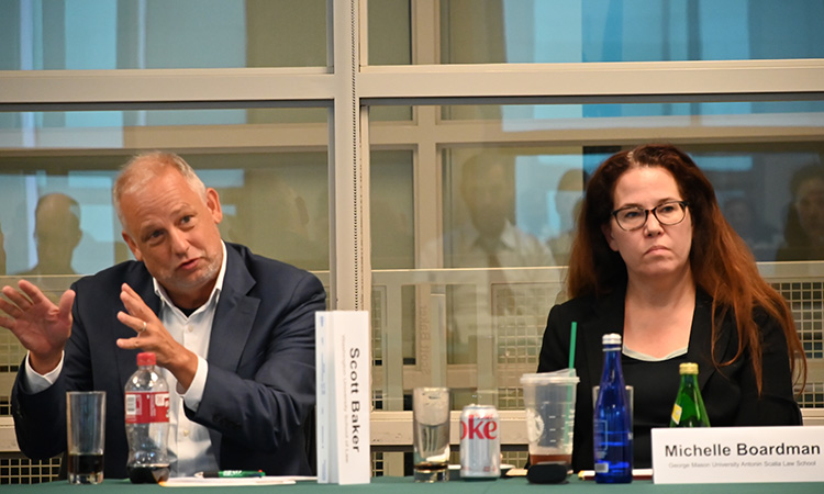 S. Baker and M. Boardman sitting at a table